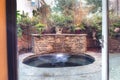 Oval Hot Tub Spa With Waterfall And Feng Shui Garden Decor